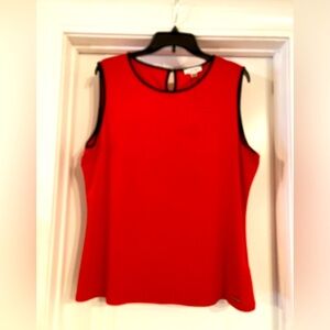 NWT Calvin Klein Poppy Red sleeveless blouse with black neck and armhole trim.